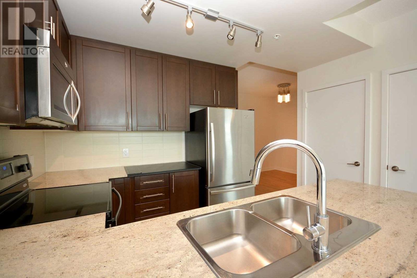 309 – 3985 Grand Park Drive